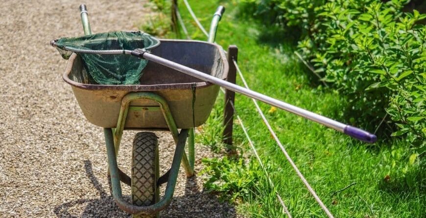 Garden Wheel Barrow Outdoors On A Courtyard إيزي جاردن خدمات تنسيق الحدائق في الكويت
